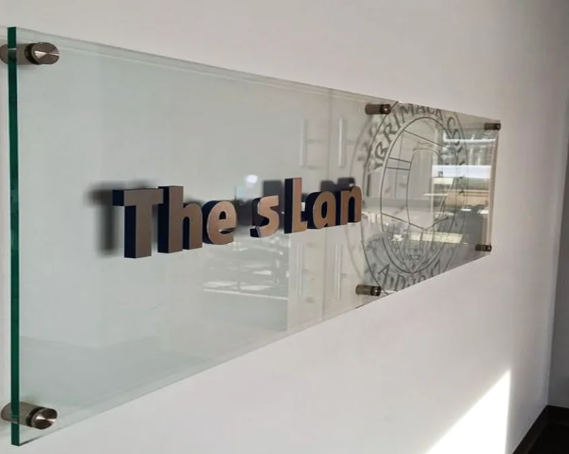 Professional acrylic wall sign 'The Stan' with dimensional lettering and standoff mounting