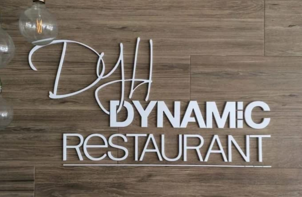 Dynamic restaurant acrylic cut-out signage with modern typography