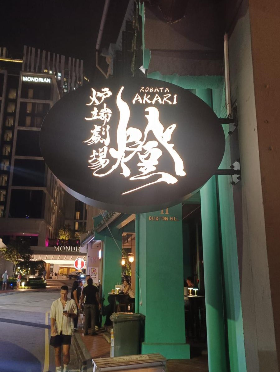 Backlit die-cut stencil signage with LED illumination through cut-outs