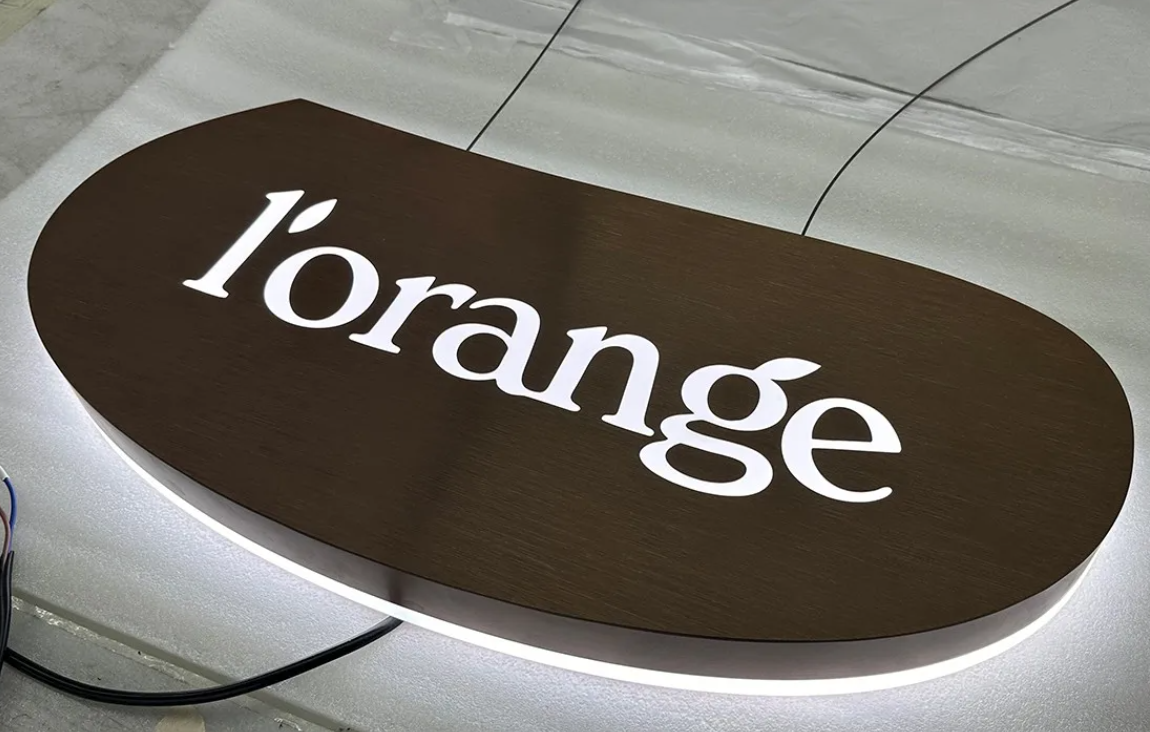 Die-cut stencil signage with integrated LED lighting system