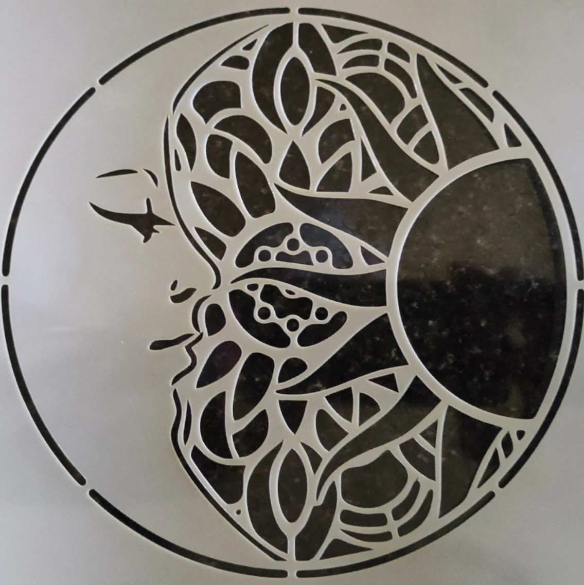 Sun and moon die-cut stencil design for decorative architectural signage