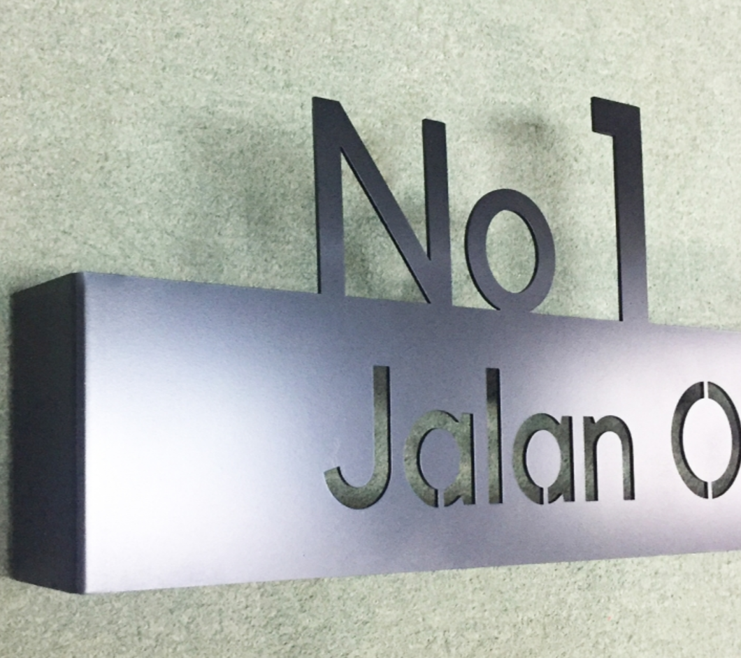 Unit number die-cut stencil signage for building wayfinding system