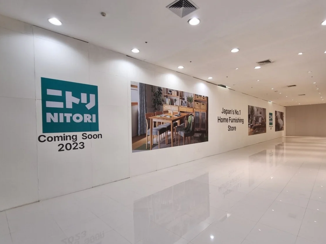 Nitori furniture store hoarding stickers with brand logo and messaging