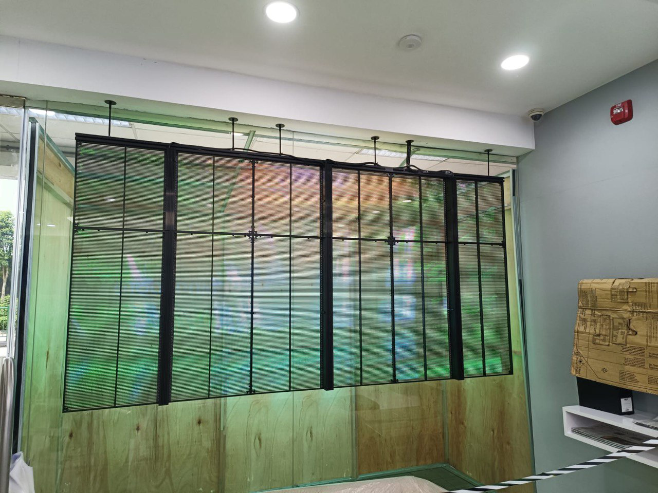 Transparent LED video wall for storefront window advertising without blocking daylight