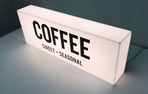 Acrylic lightbox signage with vinyl sticker graphics and even illumination