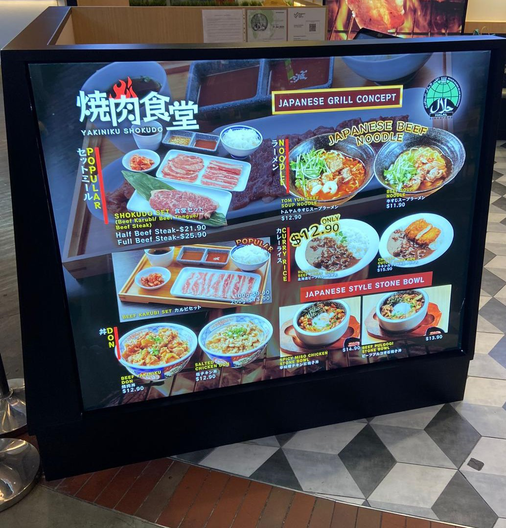 Lumisheet panels integrated in professional lightbox signage for commercial advertising