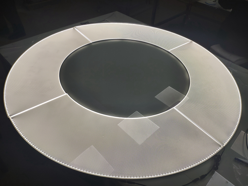 Custom circular Lumisheet light guide panel design for architectural lighting