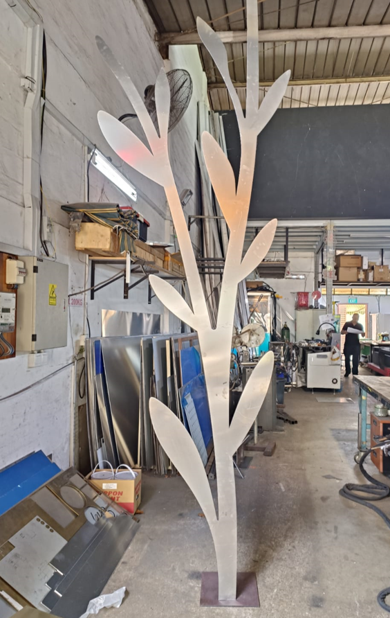 Artistic metal tree sculpture fabricated from aluminum with powder coating